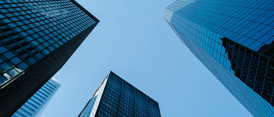 several skyscrapers from below as a symbol for companies