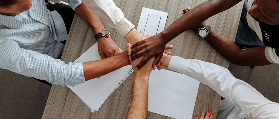 five people give themselves the hang in the shape of a star as a symbol of support from foundations